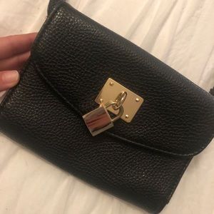 Black clutch with gold lock